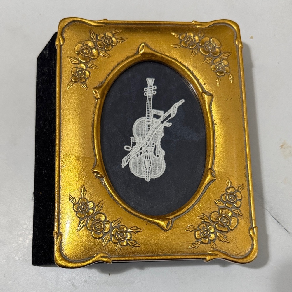 Photo album with musical instrument cover